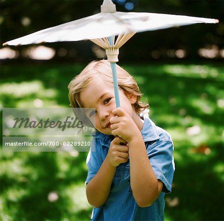 Portrait of Little Boy Holding Parasol, Malibu, California, USA