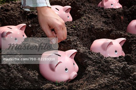 Woman Depositing Coin in Planted Piggy Bank