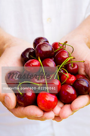 Man Holding Cherries
