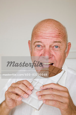 Man Eating Chocolate Bar