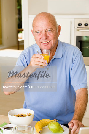 Portrait of Man Eating Breakfast