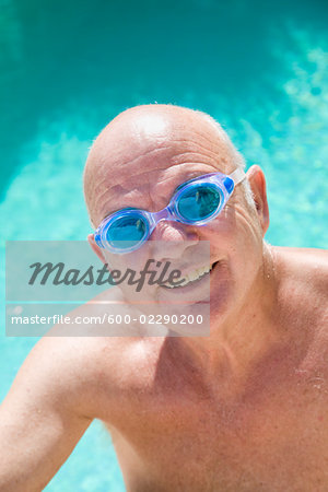 Portrait of Man in Swimming Pool Wearing Goggles