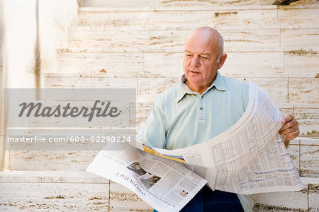 Man Reading Newspaper