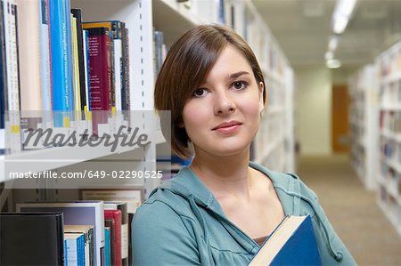 Young woman with library book