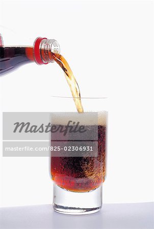 Pouring coca cola into a glass