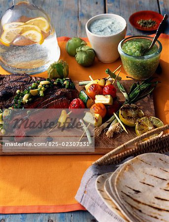 Piece of grilled beef with vegetables on the chopping board
