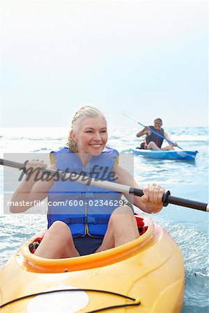 Woman and Man Kayaking