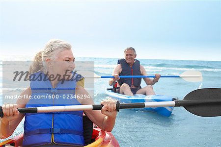 Woman and Man Kayaking