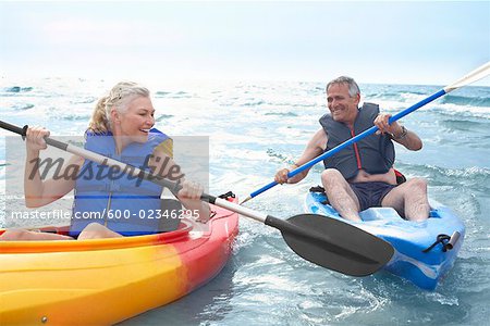 Woman and Man Kayaking