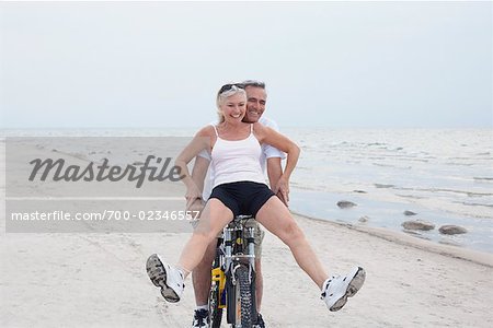 Couple Riding Bike on the Beach, Elmvale, Ontario, Canada