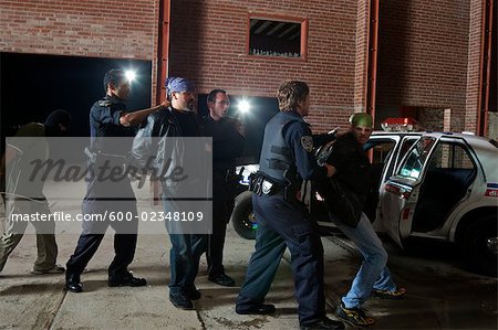 Police Officers Arresting Suspects