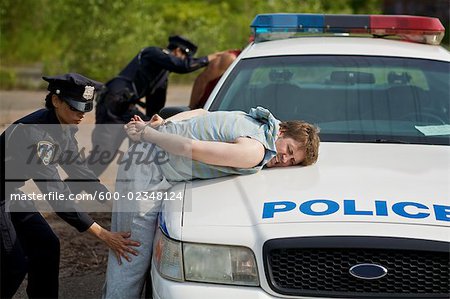 Police Officers Arresting Suspects