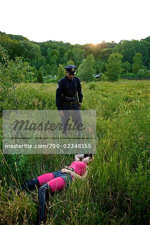 Police Officer Finding Woman's Body in Field, Toronto, Ontario, Canada
