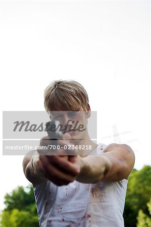 Criminal Pointing Gun at Camera, Toronto, Ontario, Canada