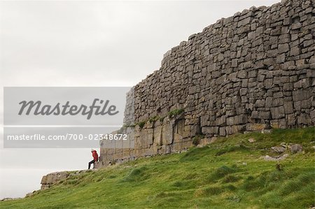 Woman at Dun Aengus Fort, Inishmor, Aran Islands, County Galway, Ireland