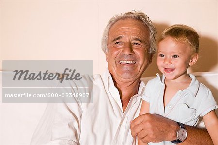 Little Boy and Grandpa Watching Television