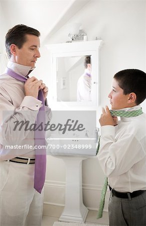 Father and Song Getting Ready for a Wedding, Father Teaching Son How to Tie a Necktie