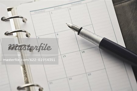 Open diary with fountain pen