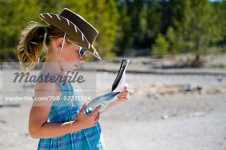 Girl Reading Map, Yellowstone National Park, Wyoming, USA