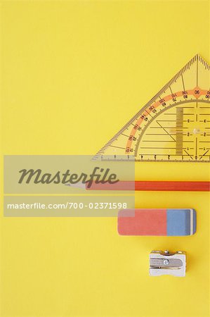 Close-up of Pencil Sharpener, Pencils, Eraser, and Protractor