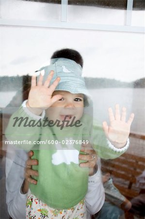 Baby Looking Through Ship Window