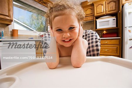 Portrait of Baby Girl in High Chair