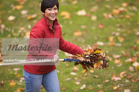 Woman Raking Leaves