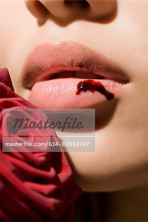 A woman with a bleeding lip