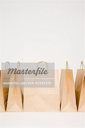 Five paper bags in a row