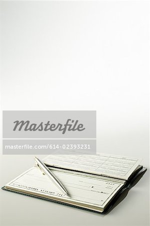 Cheque book and pen