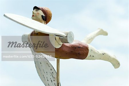 Wooden whirligig carved in the shape of female swimmer