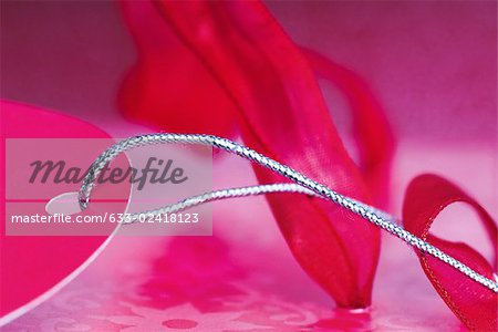 Pink gift tag and ribbon, extreme close-up Pink gift tag and ribbon, extreme close-up