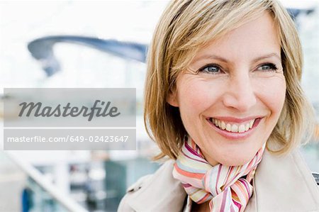 Woman close up smiling into distance