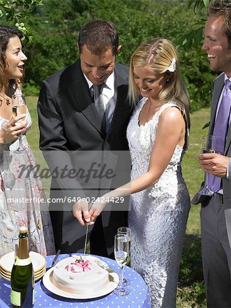 Wedding couple cutting cake