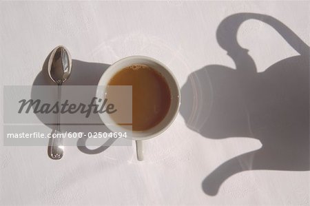 Shadow of Teapot Over Cup of Tea