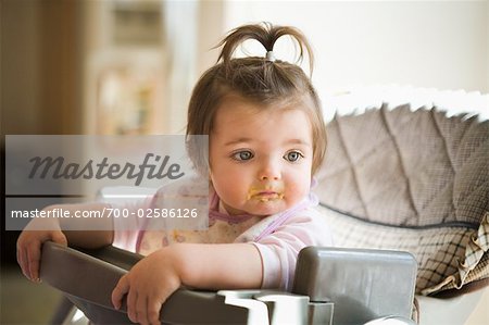 Portrait of Girl in High Chair