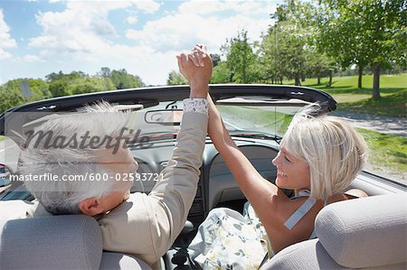 Excited Couple in Convertible, Niagara Falls, Ontario, Canada