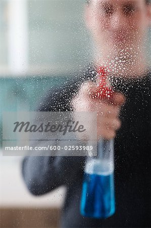 Man Cleaning Glass