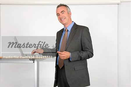 Portrait of a lecturer using a laptop