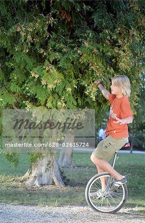 Blonde Boy on an Unicycle - Legerdemain - Youth - Leisure Time - Park