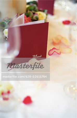 Menu Card on a Table with Rose Petals on it - Decoration - Party - Wedding