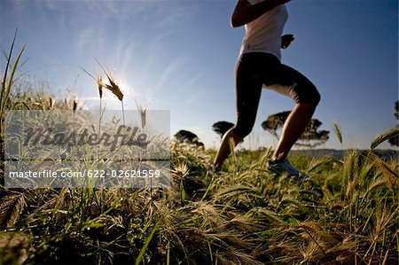 Girl jogging in countryside