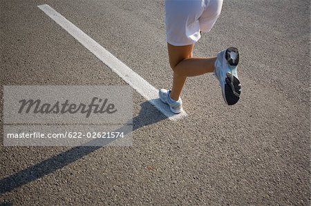 Teenage Girl Running on a Track