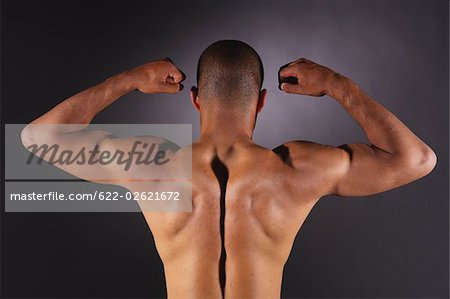 Muscular man showing biceps