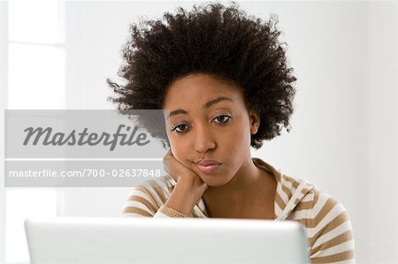 Woman at Her Computer, Looking Frustrated