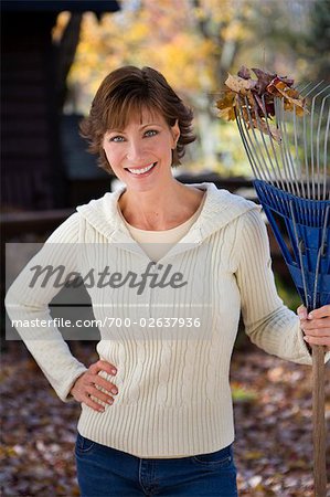 Portrait of Woman Holding Rake