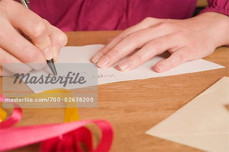 Close-up of Woman Signing Birthday Card