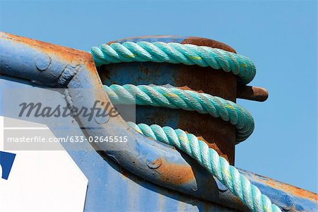 Rope coiled around boat rigging, extreme close-up