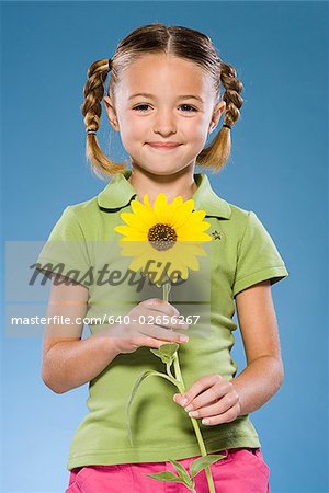 Child holding a flower.
