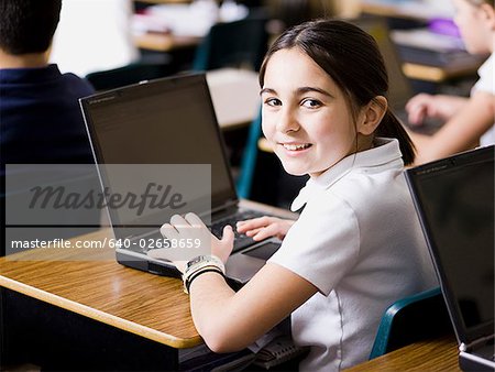 girl with laptop at school